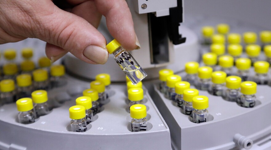 Vials are prepared to test medical marijuana at Sunrise Analytical lab in Wilsonville, Ore.