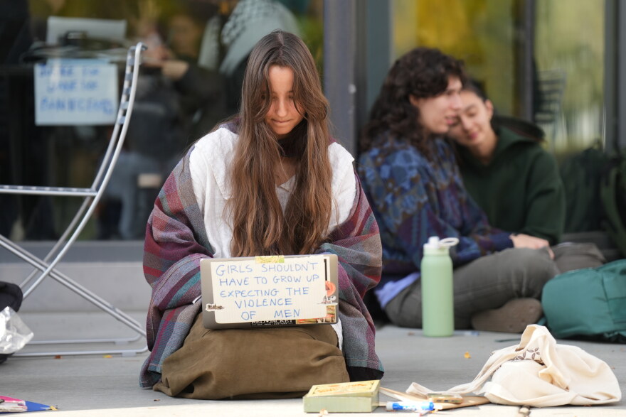 Student Isabel Breslin works on her laptop during a sit-in protest at Cornell University, Wednesday, Oct. 7, 2026, in Ithaca, N.Y.