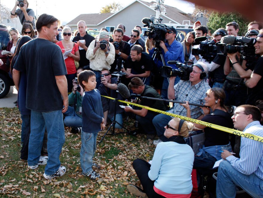 Six-year-old Falcon Heene (front right) joins his parents Richard and Mayumi during a news conference outside the family's home in Fort Collins, Colo. on Thursday.
