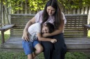 Estefania Aultman and her son Lucas, 6, outside their home in Sorrento, La., December 7, 2025. Aultman has expressed concern over a CO2 pipeline being built near Sorrento Primary School, which her son attends.
