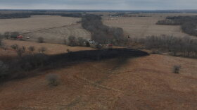 A black streak of oil on the brown countryside in north-central Kansas.