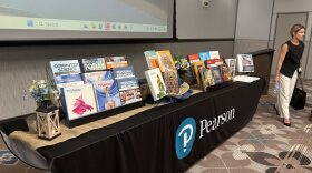 A presenter walks past a textbook display at an Oklahoma State Textbook Committee meeting July 16. The focus this year is social studies, and new controversial standards are being used to evaluate the materials.