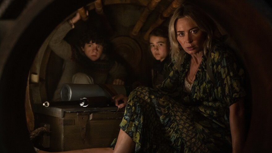 Marcus (Noah Jupe), Regan (Millicent Simmonds) and Evelyn (Emily Blunt) brave the unknown in <em>A Quiet Place Part II.</em>