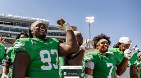 North Texas defensive lineman Terrell Washington (93) and Shane Whitter (7) celebrate with teammates at DATCU Stadium. UNT will look to build on a 5-0 start Friday when the Mean Green host South Florida.