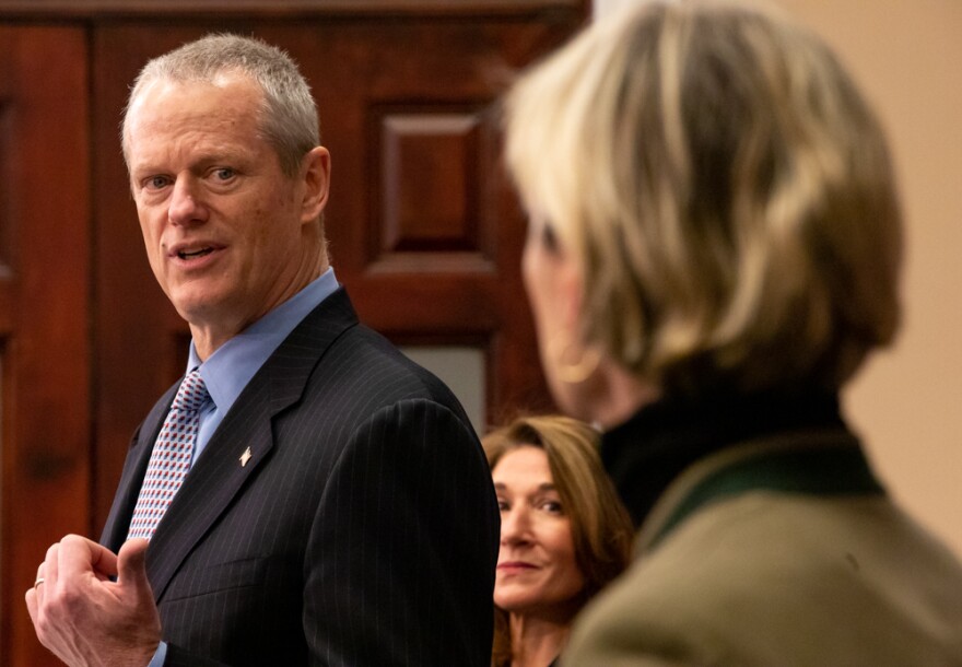 Massachusetts Governor Charlie Baker gestured to Health and Human Services Secretary Marylou Sudders while giving his daily COVID-19 press briefing on Saturday, March 21, 2020.