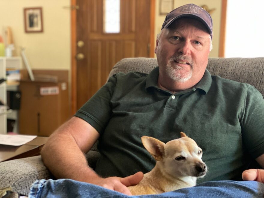 With his dog Hercules sitting on his lap, Damon Hatfield talks about the night his wife died by firearm suicide. Hours later, he agreed to allow a family member to hold onto his guns. 
 