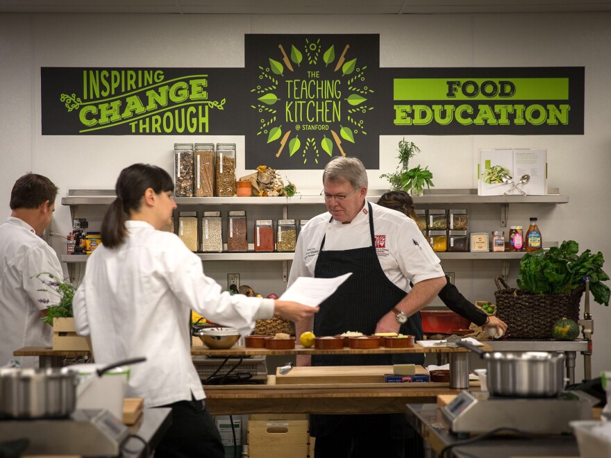 Stanford Teaching Kitchen's culinary team checks on ingredients for the program's various cooking classes.