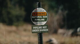 A sign for an Xcel Energy natural gas pipeline buried underground in Colorado, 2018.