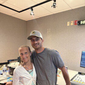 Former Lincoln Avenue School teacher Amy Domagowski and alumnus Todd Gross are smiling for a picture.