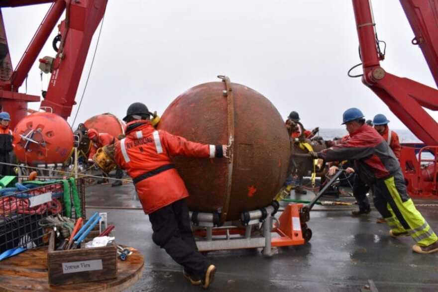 Researchers recover an old mooring from Ocean Station Papa during an Ocean Observatories Initiative expedition.