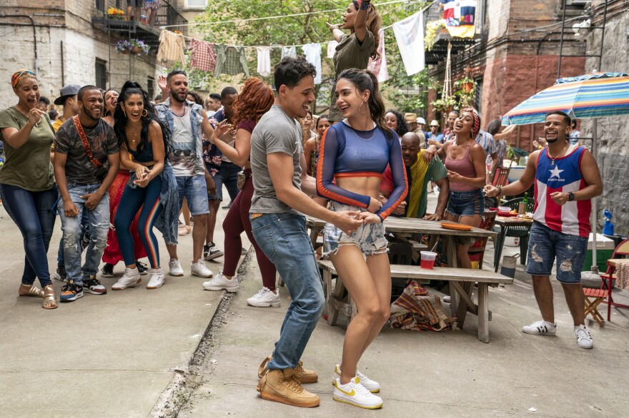 A scene from "In the Heights," with Anthony Ramos and Melissa Barrera (center) and cast. (Photo by Macall Polay)