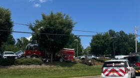 A photo of a High Point Fire Truck that struck multiple unoccupied vehicles while driving off the road.