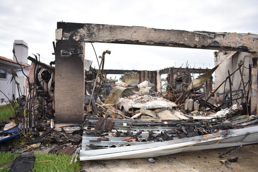 the smoldering ruins of what was once a house.