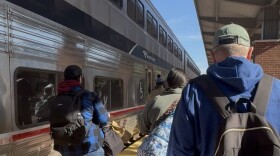 Travelers move across the platform at Fort Worth Central Station.