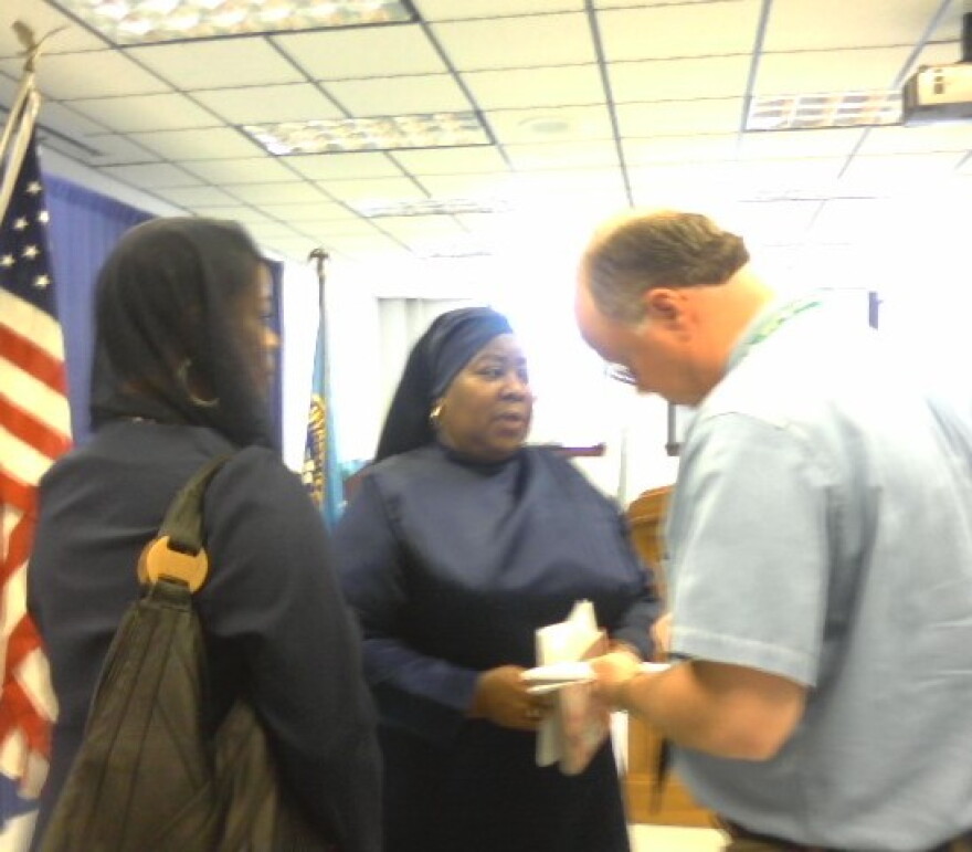 Bettie Muhammad, cousin of the victim talks with reporters at Police Headquarters