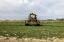 FILE - In this April 5, 2021 file photo, farmer Rick Clifton drives a spray tractor across one of his fields, applying herbicide to cover crops that occupied the ground during fall and winter in Orient, Ohio.