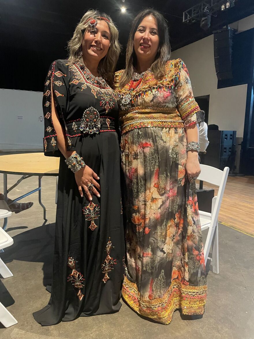 “Thank you Lawrence” event organizers Hafidha Mansouri, left, and Louiza Cherfi, right, wear the traditional garment of the Berbers, an indigenous population in Algeria. Mansouri said it was heartwarming to see the Lawrence women who were gifted Berber dresses rushing to the Granada bathroom and coming back quickly changed.