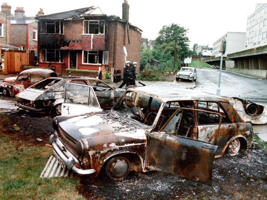 Burnt out cars are seen following attacks on police and firefighters in Tottenham in London, October 1985. Riots in London in August 2011 seem to mirror attacks like this.