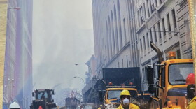 First responders at the World Trade Center use masks and breathing apparatuses.