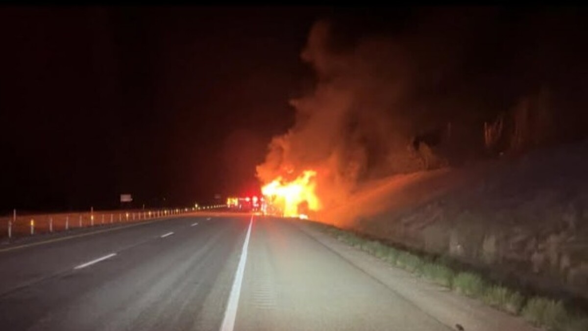 Early morning North Summit motorhome fire spreads to grass, closes highway