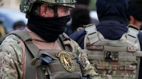 Oathkeeper militia members are confronted by demonstrators protesting the lack of criminal charges in the police killing of Breonna Taylor, in downtown Louisville, Kentucky.