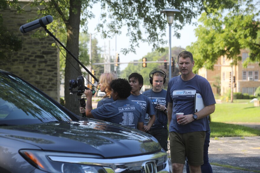 Fresh Films director Estlin Feigley (right) with students from Las Vegas and Georgia shooting a new streaming series this month in Rock Island.