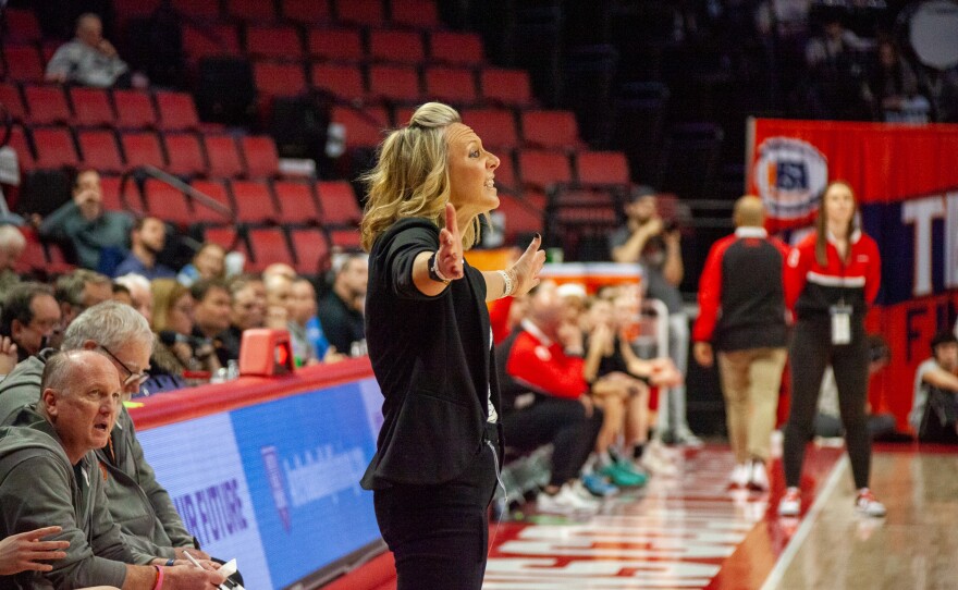 Girls high school basketball players inside an arena