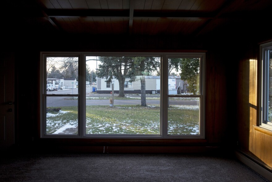Homes at Park Plaza Cooperative are seen through the window of a rental home.