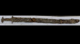 An Iron Age sword was discovered by an 8-year-old girl who was wading in a lake this summer in southern Sweden, in what local authorities called "a spectacular find."