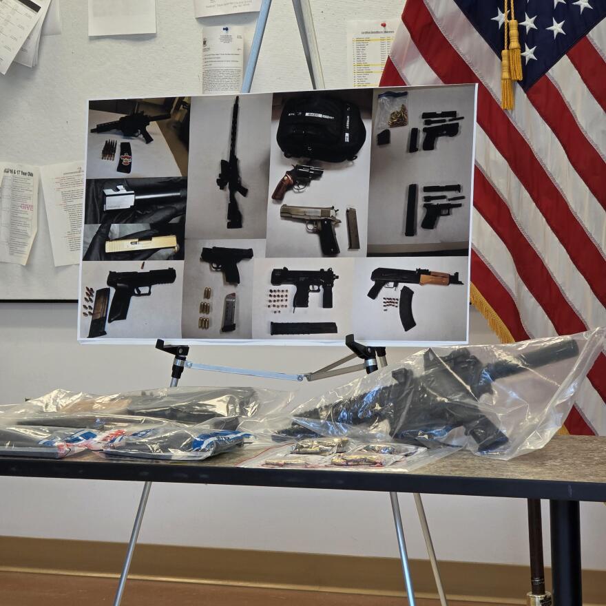 Niagara Falls police display weapons and ammunition recovered through local anti-violence initiatives during an Aug. 5 news conference.