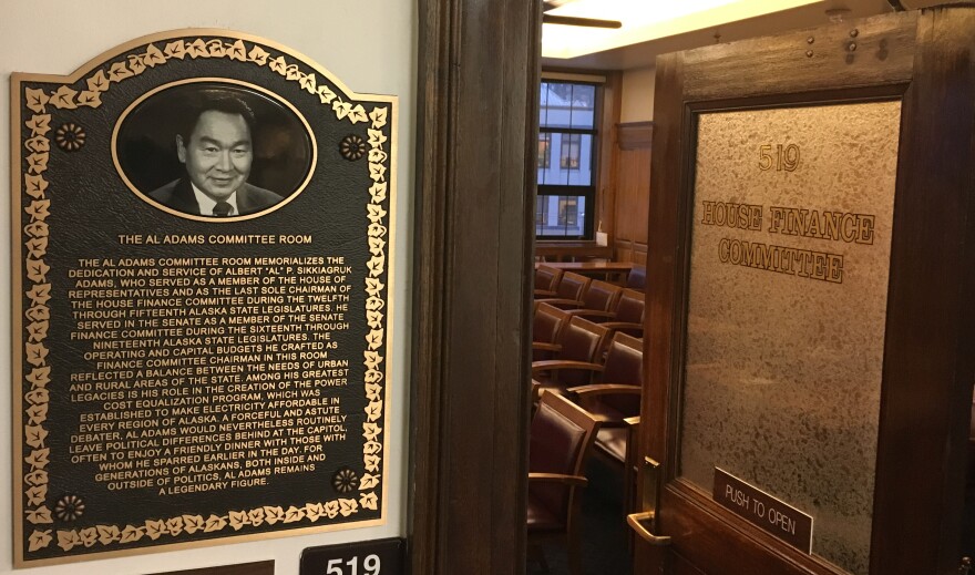 This plaque marks the newly renamed Al Adams Committee Room, where the House Finance Committee meets in the Alaska State Capitol. House finance subcommittees have been finishing their work this week. (Photo by Andrew Kitchenman/KTOO)