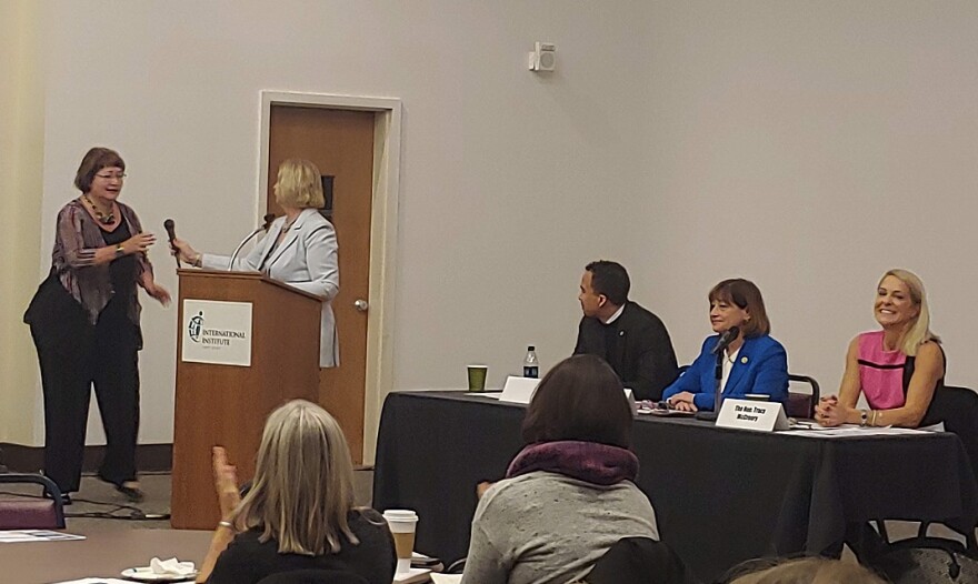 Anna Crosslin of the International Institute (far left) makes closing remarks at Wednesday panel with state democratic lawmakers on immigration policy.