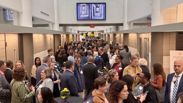 Officials and residents gather inside the new Ypsilanti Health Center.