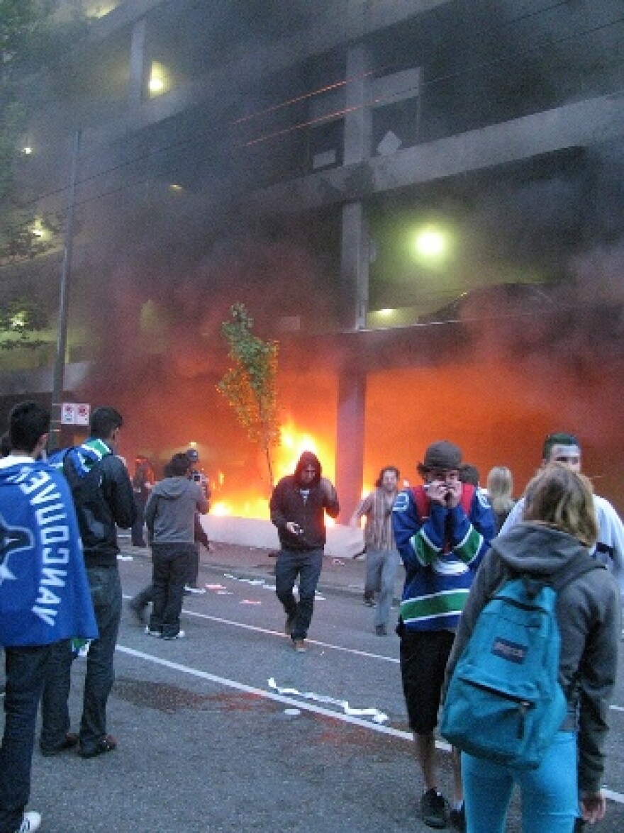 Parked cars were set on fire, others were tipped over, and looters shattered storefronts and ransacked businesses following the Vancouver Canucks' 4-0 loss to the Boston Bruins on Wednesday night in Game 7 of the Stanley Cup finals.