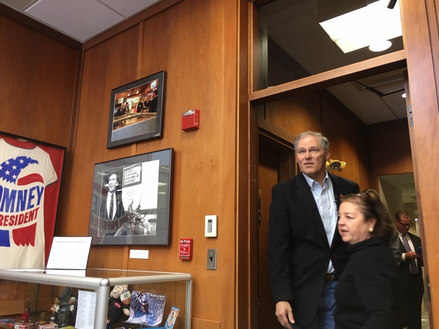 Gov. Jay Inslee enters a conference room at the New Hampshire Institute of Politics at Saint Anselm College where he spoke to students last month.