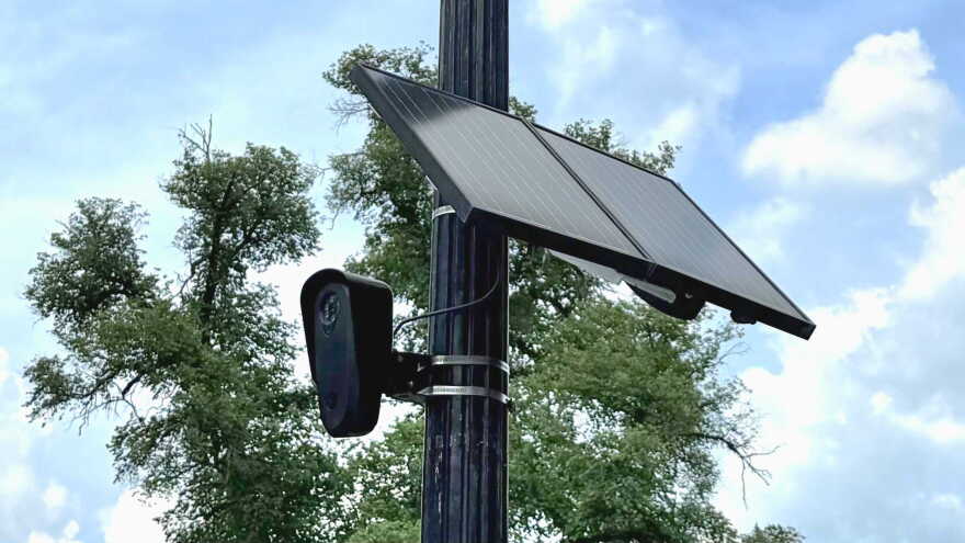 Flock Safety surveillance camera on a lightpole on High Street