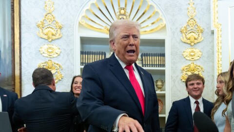 President Donald Trump speaks with reporters during the swearing in ceremony for Homeland Security Secretary Markwayne Mullin in the Oval Office of the White House, Tuesday, March 24, 2026, in Washington.