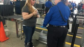In this role playing episode at CVG, a TSA passenger support specialist helps the traveler navigate  security.
