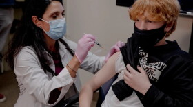 Luke DeGennaro, 11, of Mansfield, gets vaccinated at Mansfield Family Practice in Storrs last November after eligibility opened for 5-to-11-year-olds.