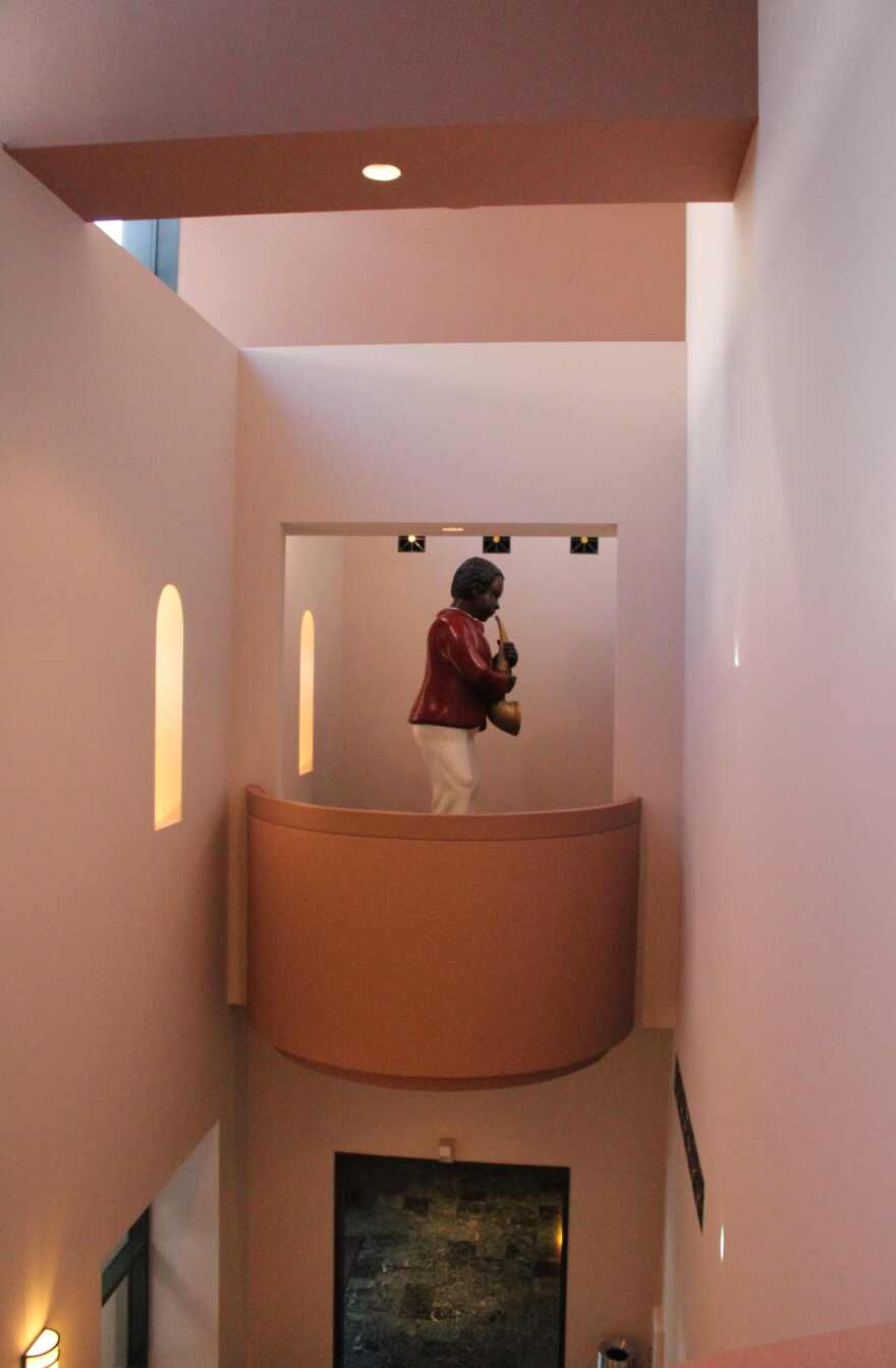 'The Saxophonist' occupies an alcove outside the Hayes Hall exhibition of Reginald O'Neal's Jazz Figurine paintings.