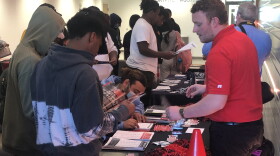 Students at Little Rock Southwest High School speak with a recruiter from Arkansas State University on Wednesday, Oct. 5, 2022.