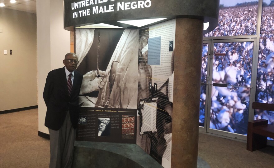 Tuskegee civil rights attorney Fred Gray shows an exhibit on the syphilis study at the Tuskegee History Center. Gray represented the men when the truth about the study came out in 1972. He won a $10 million settlement for the men, and their families.
