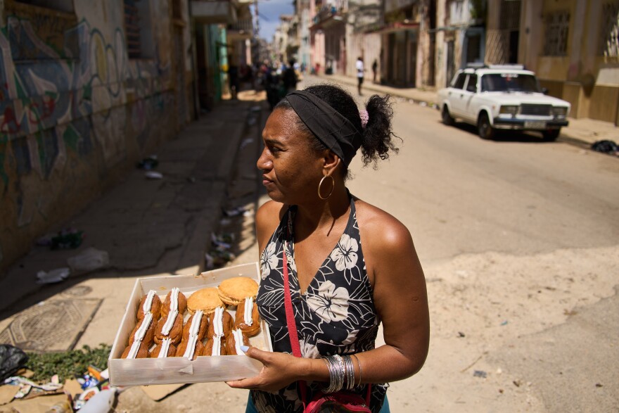 Yuneisy Riviaux sells pastries in Havana, Cuba, Saturday, March 28, 2026. (AP Photo/Ramon Espinosa)