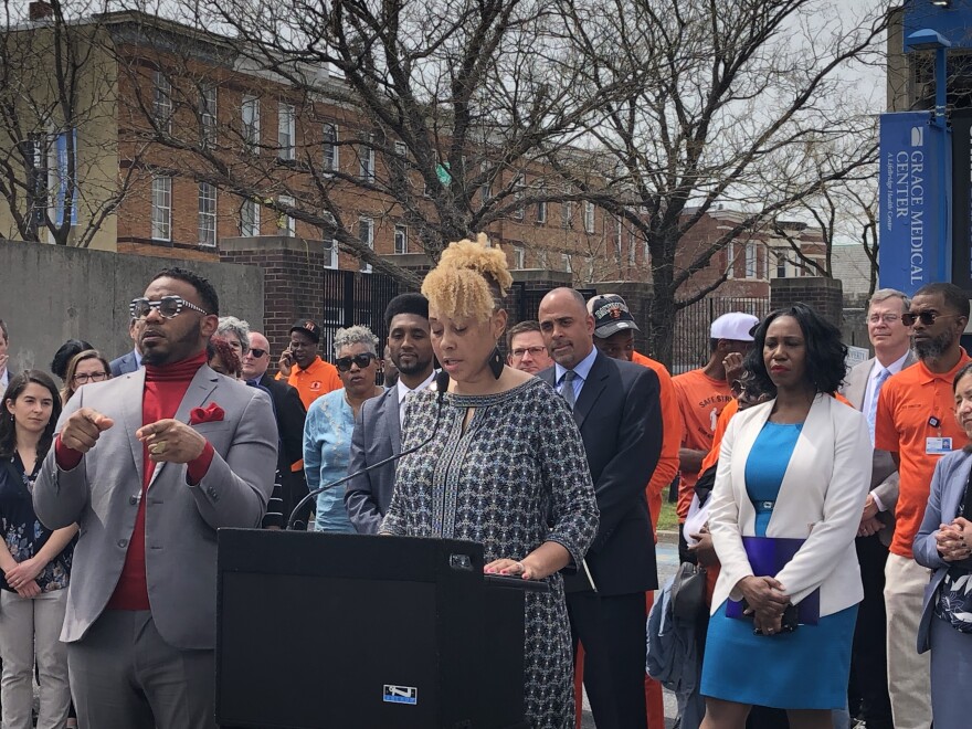 MONSE director Shantay Jackson presents the results of the Safe Streets evaluation, joined by the mayor, Safe Streets Workers and hospital officials. Credit: Sarah Y. Kim/WYPR