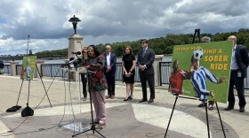 Mayor Dorcey Applyrs stands at a podium at Jennings Landing as she announces upcoming World Cup festivities.