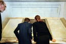 Dennis A. Daellenbach, the Director of the Gerald R. Ford Presidential Library And Museum, left, looking over their shoulders, Adam Jennison, 13, of NW DC, middle, and Madeleine Joseph, 13, of Northwest Washington, take their first peek at the actual Bill of Rights document, Wednesday, September 17, 2003. President George W. Bush joined others to celebrate the re-opening of the National Archives Rotunda after a two-year renovation, in Washington, DC.