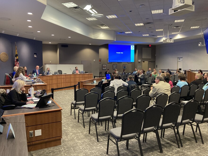 Residents gathered after the final vote on policy 443, to express support and dissent at the Board of Education meeting Wednesday