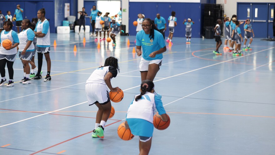 Pictured: WNBA star Aliyah Boston coaches two young athletes during her 2026 Girls Basketball Clinic on St. Thomas.
