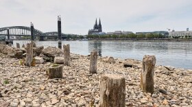 Remains of the post-World War II Patton Bridge are exposed during historically low water levels of the Rhine River during a heat wave and a prolonged drought, across from the Cologne Cathedral in Cologne, Germany, Monday, Aug. 3, 2026.