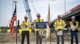 Gov. Dan McKee speaks at a press event this week marking the start of in-water construction on the Washington Bridge replacement project. The new western span is not expected to be completed until late 2028, keeping the bridge’s closure, traffic backups and political fallout front and center heading into the 2026 election.